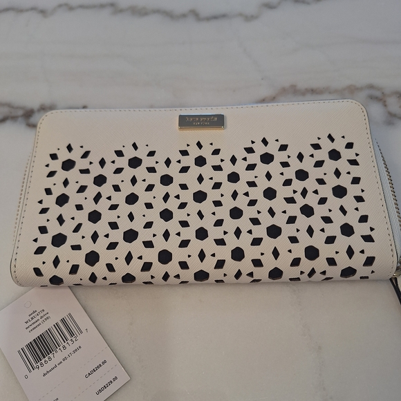 kate spade Handbags - NWT Kate Spade Off White & Black Laser-Cut Continental Wallet. Textured Leather